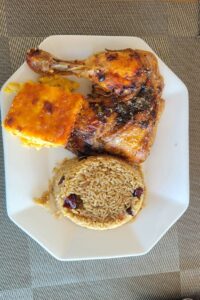 Taste Buds Restaurant baked chicken with peas and rice and mac and cheese